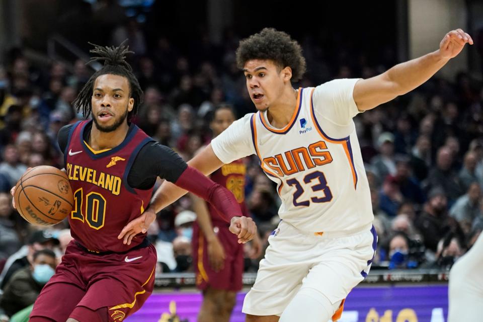 Cleveland Cavaliers' Darius Garland (10) drives against Phoenix Suns' Cameron Johnson (23) during the second half of an NBA basketball game Wednesday, Nov. 24, 2021, in Cleveland. (AP Photo/Tony Dejak)