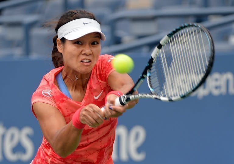 Li Na returns a shot to Olga Govortsova of Belarus during their US Open match in New York on August 26, 2013. Li reached the second round with a 6-2, 6-2 win over Govortsova