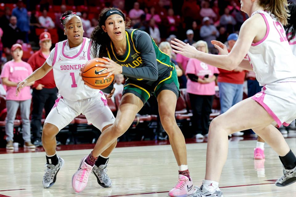 Baylor guard Darianna Littlepage-Buggs (5) looks to pass past Oklahoma guard Payton Verhulst (12) in the first quarter during an NCAA basketball game between University of Oklahoma (OU) and Baylor University, in Norman Okla., on Wednesday, Feb. 14, 2024.
