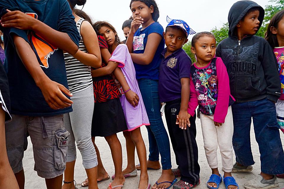 Children and adults in line