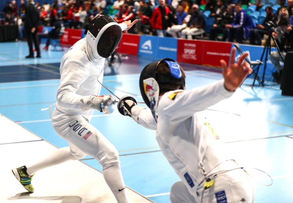 Alen Hadzic, left, fences Max Heinzer of Switzerland during the individual finals at the Peter Bakonyi Men's Epee World Cup in Richmond, Canada in 2020. (Devin Manky/Getty Images)