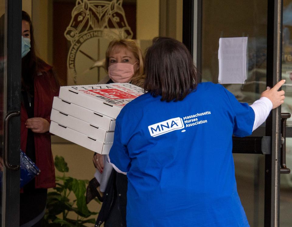 Voting by nurses lasted all day Monday. A Massachusetts Nurses Association member brings food to the voting site, Teamsters Local 170 office on Southwest Cutoff.