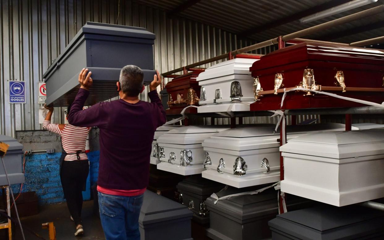 Mexican casket makers face demand for caskets and black market in pandemic, Mexico City - Shutterstock