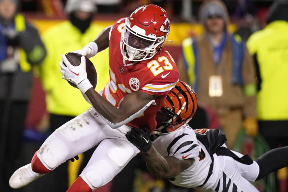 Kansas City Chiefs cornerback Joshua Williams (23) intercepts the ball against the Cincinnati Bengals during the second half of the NFL AFC Championship playoff football game, Sunday, Jan. 29, 2023, in Kansas City, Mo. (AP Photo/Brynn Anderson)