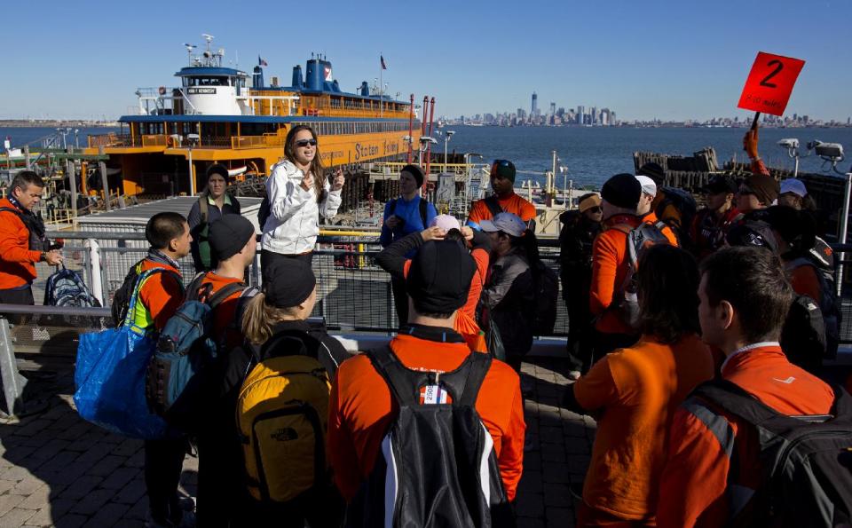 Runners prepare to board the Staten Island with goods and supplies for Superstorm Sandy victims, Sunday, Nov. 4, 2012 in New York. With the cancellation of the New York Marathon, hundreds of runners, wearing their marathon shirts and backpacks full of supplies, took the ferry to hard-hit Staten Island and ran to neighborhoods hard hit by Superstorm Sandy to help. (AP Photo/Craig Ruttle)