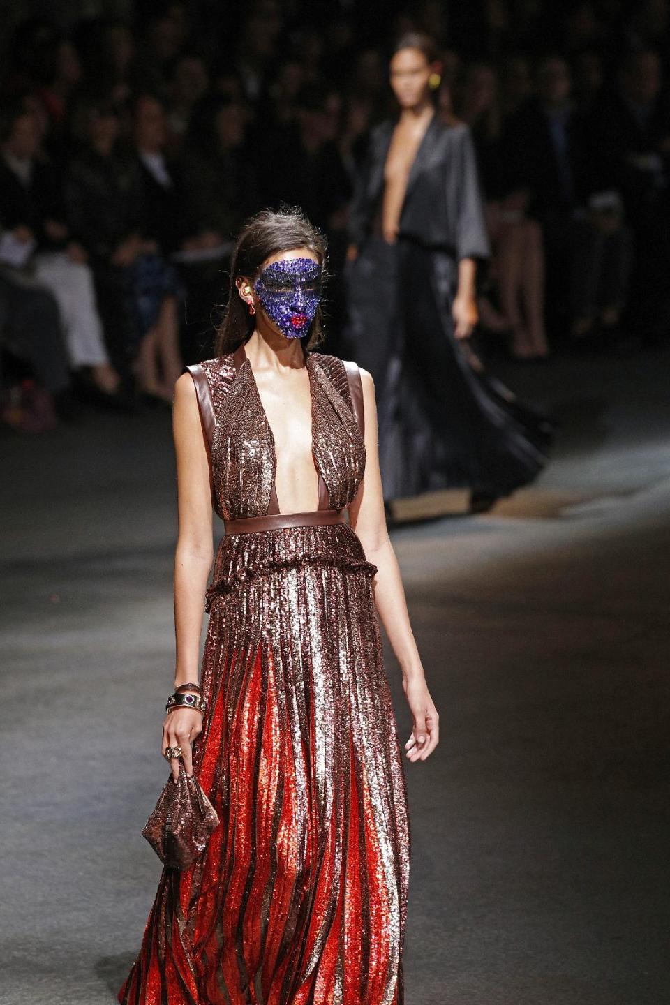 A model presents a creation as part of Givenchy's ready-to-wear Spring/Summer 2014 fashion collection, presented Sunday, Sept. 29, 2013 in Paris. (AP Photo/Christophe Ena)