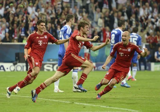 Bayern Munich's forward Thomas Mueller (C) celebrates after scoring a goal during their UEFA Champions League final football match against Chelsea at the Fussball Arena stadium in Munich. The Champions League final went into a penalty shootout on Saturday after the sides were locked at 1-1 at the end of extra-time