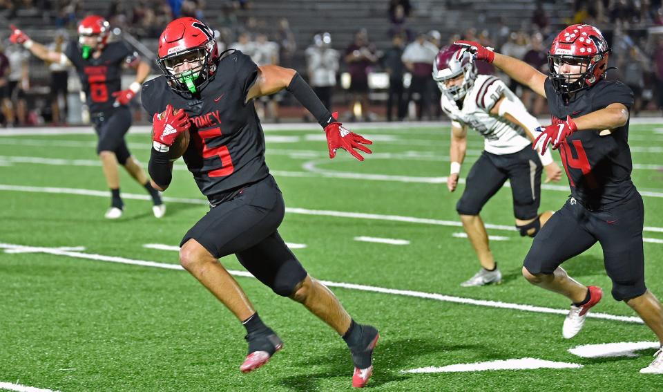 Cardinal Mooney Catholic Cougar linebacker George Leibold gets a interception off of the Riverview Rams in the third quarter of play at the Ram Bowl in Sarasota on Tuesday, Nov. 1, 2022. THOMAS BENDER/ HERALD-TRIBUNE