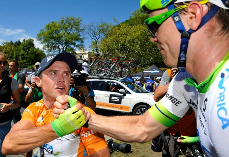 Australia's Simon Gerrans (L) is congratulated by teammate Michael Hepburn of the Orica Greenedge team after stage six of the Tour Down Under cycling race in Adelaide on January 24, 2016