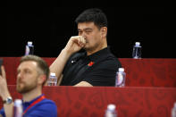 FILE - In this Sept. 4, 2019, file photo, Yao Ming, head of the Chinese Basketball Association and former NBA player, watches as China and Venezeula compete during their group phase basketball game in the FIBA Basketball World Cup at the Cadillac Arena in Beijing. Yao is now president of the Chinese Basketball Association, which announced over the weekend it is suspending its ties with the Rockets in retaliation for Houston Rockets general manager Daryl Morey's tweet that showed support for Hong Kong anti-government protesters. (AP Photo/Mark Schiefelbein, File)