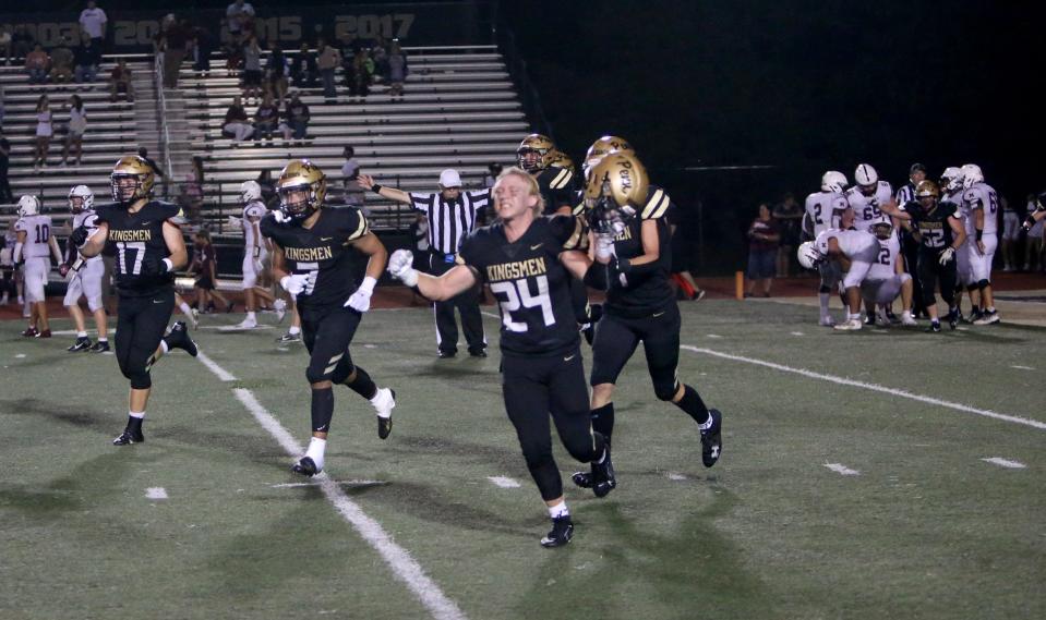 Penn cornerback Vincent Horner (24) and others celebrate after the Mishawaka vs. Penn football game Friday, Aug. 25, 2023, at Freed Field. The Kingsmen won over the Cavemen, 28-7, and Horner got a touchdown by intercepting a Mishawaka pass.