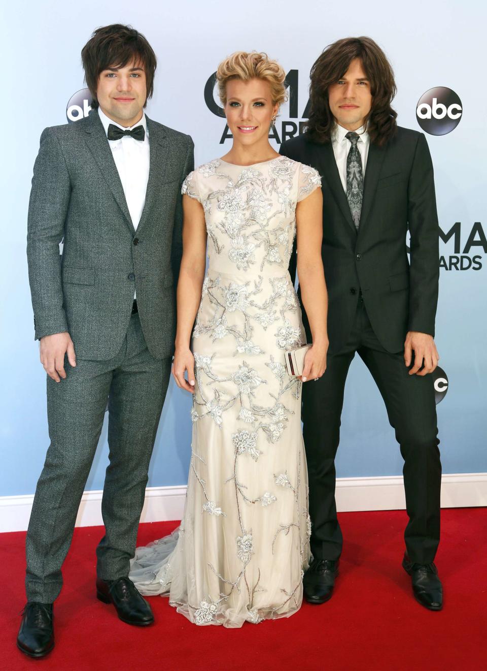 Neil Perry (L), Kimberly Perry and Reid Perry of The Band Perry poses on arrival at the 47th Country Music Association Awards in Nashville, Tennessee November 6, 2013. REUTERS/Eric Henderson (UNITED STATES - Tags: ENTERTAINMENT)