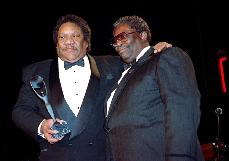 FILE - In this Jan. 15, 1992, file photo, Bobby "Blue" Bland, left, receives his award for the Rock and Roll Hall of Fame from B.B. King during induction ceremonies in New York. Bland's son Rodd said his father died Sunday, June 23, 2013, at his Memphis home surrounded by relatives. He was 83. (AP Photo/Mark Lennihan, File)