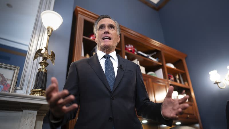 Utah Republican Sen. Mitt Romney speaks to reporters in his Capitol Hill office in Washington, Wednesday, Sept. 13, 2023. Romney has weighed in on the ouster of House Speaker Kevin McCarthy.