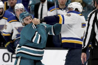 San Jose Sharks center Luke Kunin (11) and St. Louis Blues defenseman Justin Faulk (72) fight in the second period of an NHL hockey game in San Jose, Calif., Saturday, April 6, 2024. (AP Photo/Scot Tucker)