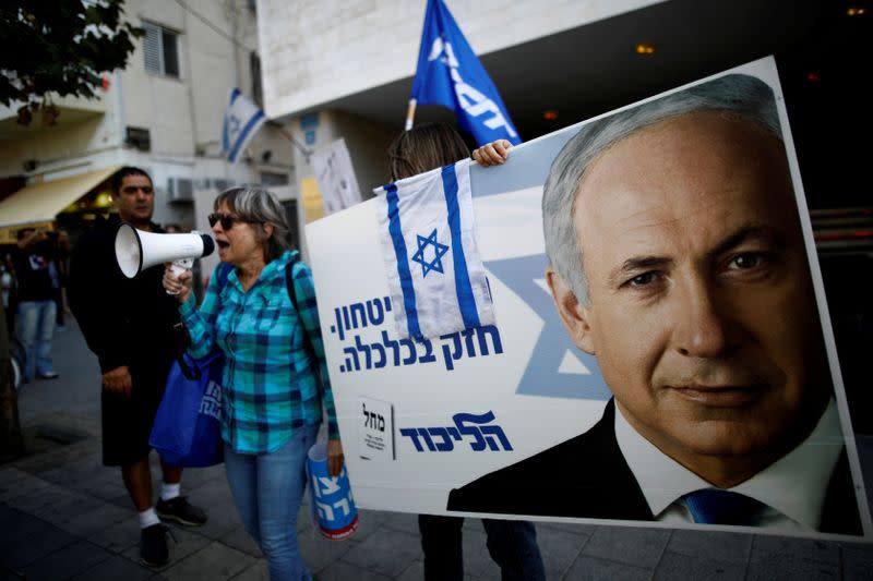 FILE PHOTO: Supporters of Israeli Prime Minister Benjamin Netanyahu protest outside Likud Party headquarters in Tel Aviv