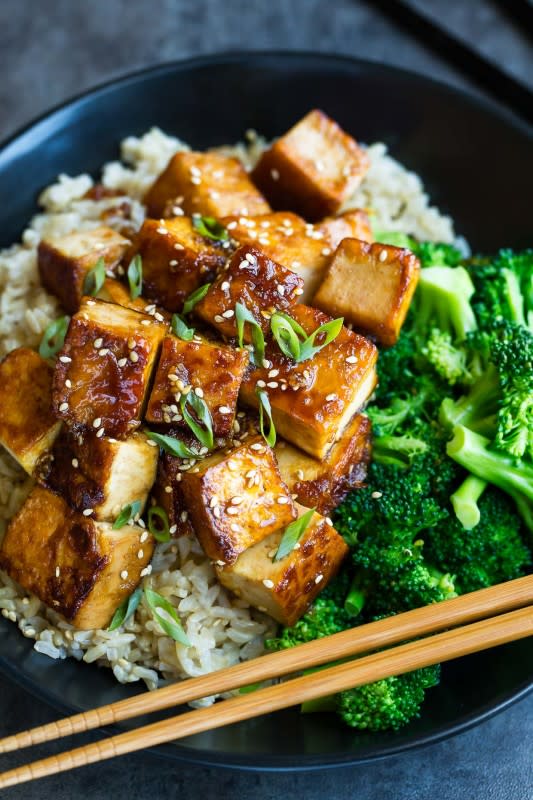 <p>Peas and Crayons</p><p>This honey garlic tofu recipe is a great way to jazz up tofu! Pair it with crisp broccoli and fluffy brown rice for a tofu bowl that’s sure to have you skipping take-out for this tasty homemade recipe!</p><p><strong>Get the recipe: <a href="https://peasandcrayons.com/2018/05/honey-garlic-tofu.html" rel="nofollow noopener" target="_blank" data-ylk="slk:Honey Garlic Tofu;elm:context_link;itc:0;sec:content-canvas" class="link "><em>Honey Garlic Tofu</em></a></strong></p>