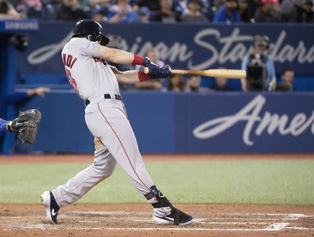 May 20, 2019; Toronto, Ontario, CAN; Boston Red Sox left fielder Andrew Benintendi (16) hits a single during the eighth inning against the Toronto Blue Jays at Rogers Centre. Mandatory Credit: Nick Turchiaro-USA TODAY Sports