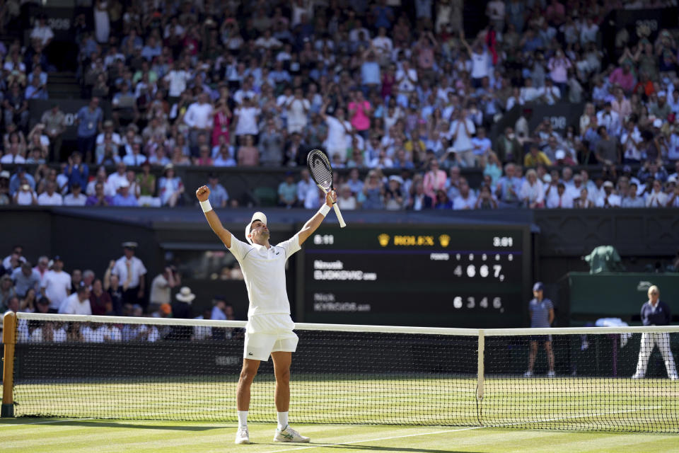 Serbia's Novak Djokovic celebrates after beating Australia's Nick Kyrgios to win the final of the men’s singles on day fourteen of the Wimbledon tennis championships in London, Sunday, July 10, 2022. (Zac Goodwin/PA via AP)