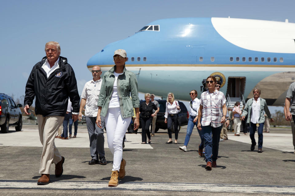 <p>President Donald Trump and first lady Melania Trump arrive at Luis Muniz Air National Guard Base to survey hurricane damage and recovery efforts, Tuesday, Oct. 3, 2017, in San Juan, Puerto Rico. (Photo: Evan Vucci/AP) </p>