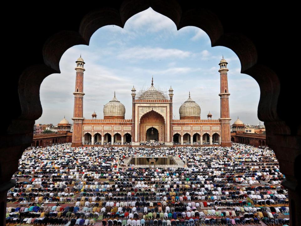 Muslims offer Eid al-Adha prayers at the Jama Masjid (Grand Mosque) in the old quarters of Delhi, India, August 22, 2018.