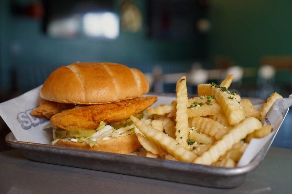 The crispy chicken sandwich and garlic fries are on the menu at the Schoolyard Bar and Brew in The Wayfarer hotel in San Luis Obispo.