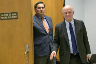 James C. Gulotta, Jr., attorney for the New Orleans Saints, right, leaves a hearing at Orleans Parish Civil District Court in New Orleans, Thursday, Feb. 20, 2020. The New Orleans Saints headed to court Thursday in a bid to block the release of hundreds of confidential emails detailing the behind-the-scenes public relations work the team did for the area's Roman Catholic archdiocese amid its sexual abuse crisis. The request comes amid claims that the NFL team joined the Archdiocese of New Orleans in a “pattern and practice” of concealing sexual abuse — an allegation the Saints have vehemently denied. (AP Photo/Matthew Hinton)