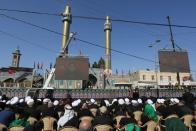 Lebanon's Hezbollah leader Sayyed Hassan Nasrallah addresses his supporters through a televised speech in Baalbeck