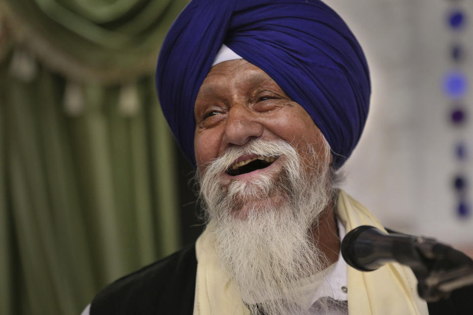 ***HOLD FOR RELIGION TEAM STORY*** Ram Asra sings to the faithful during the Shri Guru Ravidass Sabha ceremony at a temple in Fresno, Calif. Sunday, May 7, 2023. Members of the Ravidassia community in California are followers of Guru Ravidass, a 14th century Indian guru of a caste formerly considered untouchable. The Ravidassia community statewide is advocating for new legislation to outlaw caste-based discrimination. (AP Photo/Gary Kazanjian)