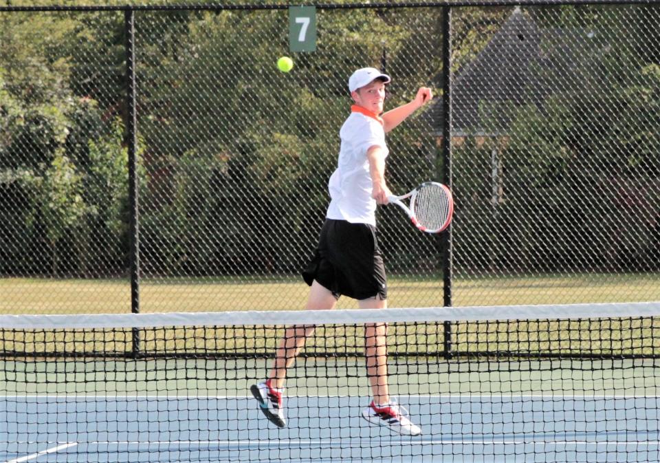 Grady Miller of Sturgis flips a ball back over the net in his match on Wednesday.