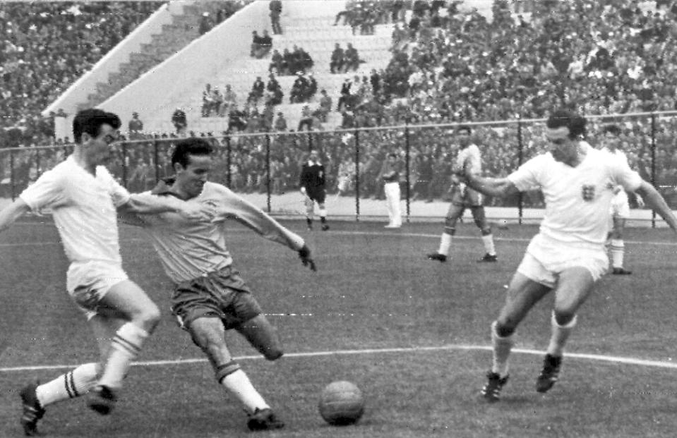 FILE - Mario Zagallo of Brazil, second left, shoots at England's goal during a World Cup quarterfinals match in Vina Del Mar, Chile, June 10, 1962. Zagallo, who reached the World Cup final a record five times, winning four, as a player and then a coach with Brazil, has died. He was 92. Brazilian soccer confederation president Ednaldo Rodrigues said in a statement in the early hours of Saturday, Jan. 5, 2024, confirming Zagallo's death that Zagallo “is one of the biggest legends” of the sport. (AP Photo, File)