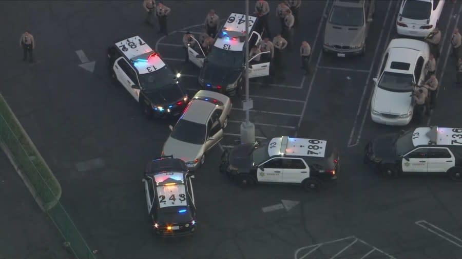 Two suspects were arrested after standing off with deputies in a Compton parking lot following a multi-city pursuit on July 5, 2024. (KTLA)