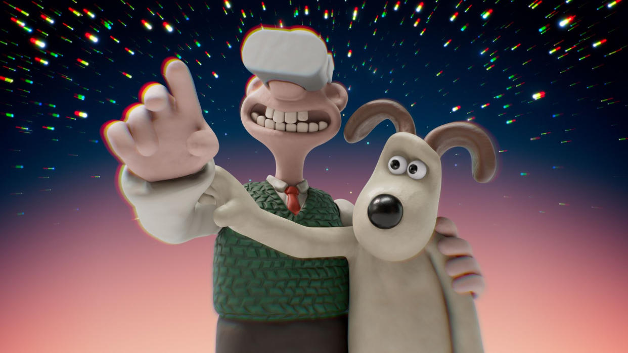  Wallace wears a VR headset and points while Gromit touches his arm to try and move it. 