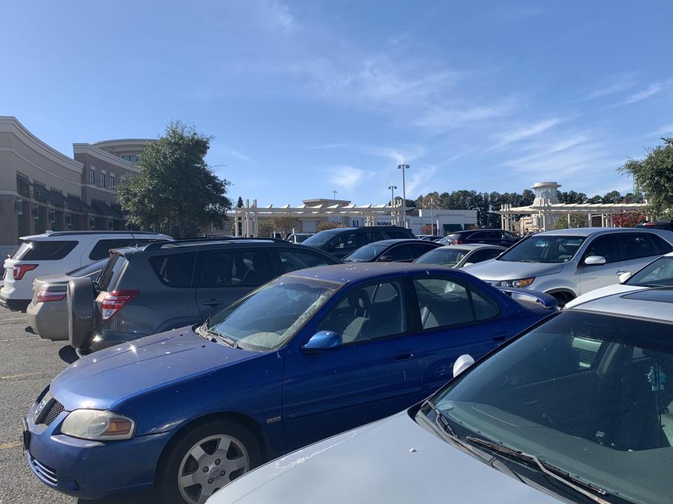 FILE - Cars sit parked at the Augusta Mall on Black Friday.
