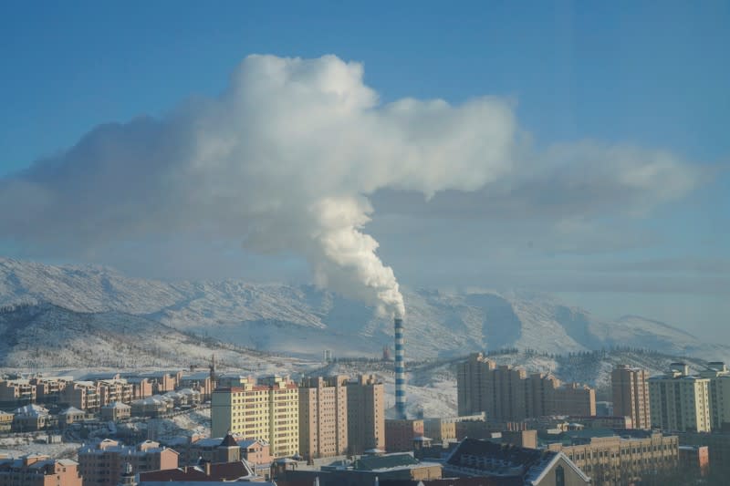 Smoke is seen from a chimney in Altay, Xinjiang Uygur Autonomous Region