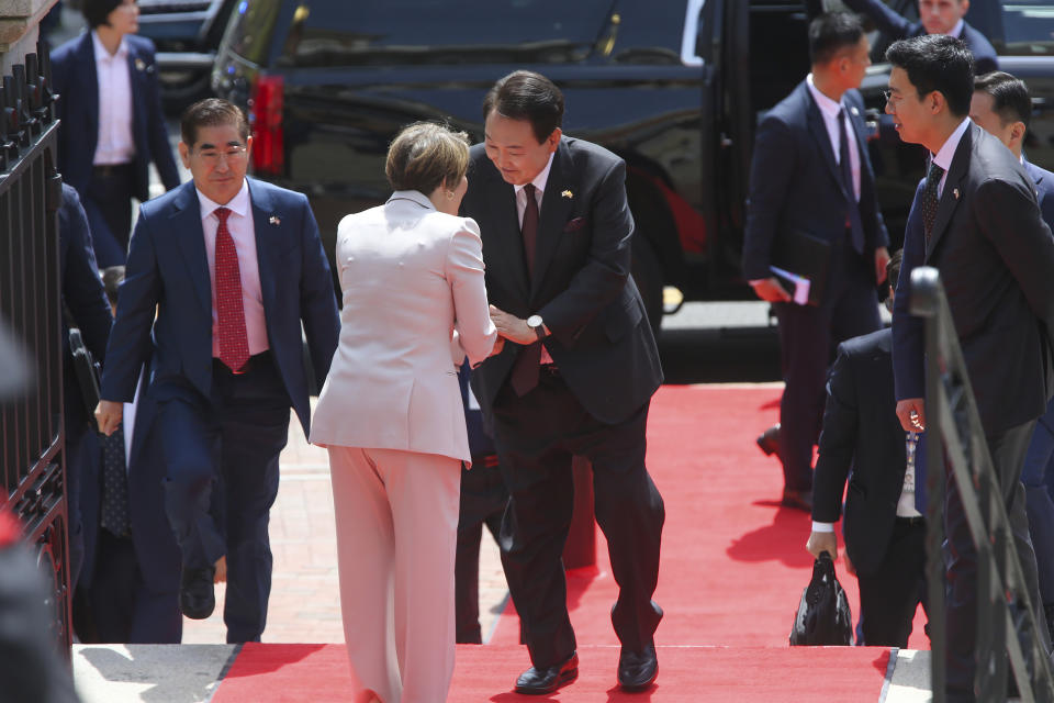 Mass. Governor Maura Healey greets South Korea's President Yoon Suk Yeol outside the Massachusetts State House April 28, 2023, in Boston, Mass. Yoon stopped at the State House ahead of a talk at Harvard University as he wrapped up a state visit to the United States. (AP Photo/Reba Saldanha)