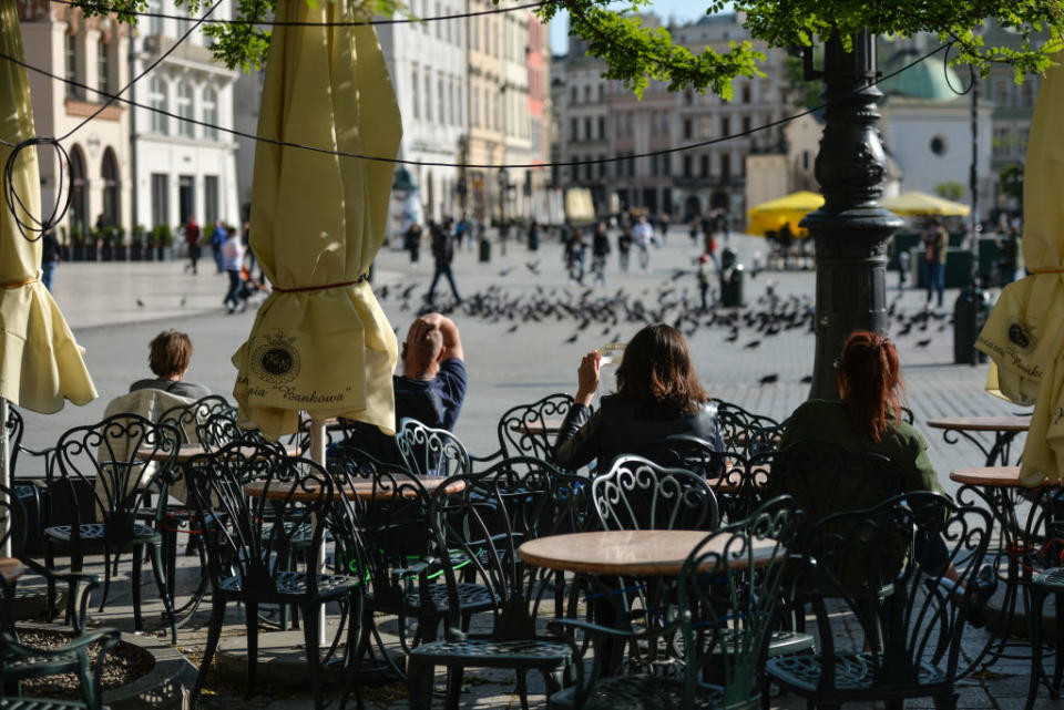 Restaurants and cafes prepare their outdoor seating for Monday's re-opening in Krakow's Main Market Square. From Monday, May 18th, the third stage of unfreezing the economy and loosening restrictions will takes place , including the opening of beauty salons, restaurants, bars and cafes. On Saturday, May 16, 2020, in Krakow, Poland. (Photo by Artur Widak/NurPhoto)