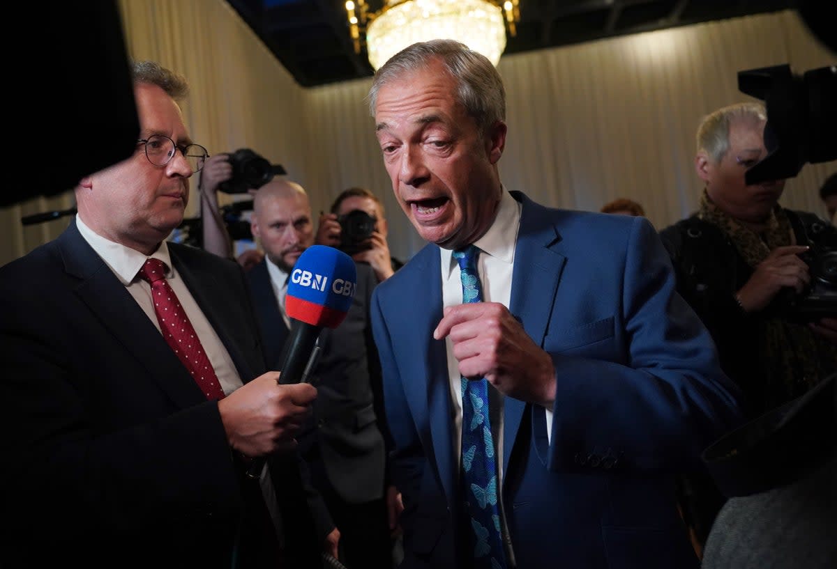 Nigel Farage is interviewed by GB News following a Reform UK press conference (PA)