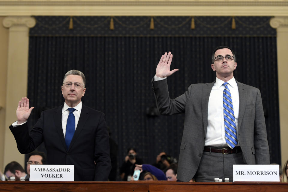 Ambassador Kurt Volker, left, former special envoy to Ukraine, and Tim Morrison, a former official at the National Security Council are sworn in to testify before the House Intelligence Committee on Capitol Hill in Washington, Tuesday, Nov. 19, 2019, during a public impeachment hearing of President Donald Trump's efforts to tie U.S. aid for Ukraine to investigations of his political opponents.(AP Photo/Susan Walsh)