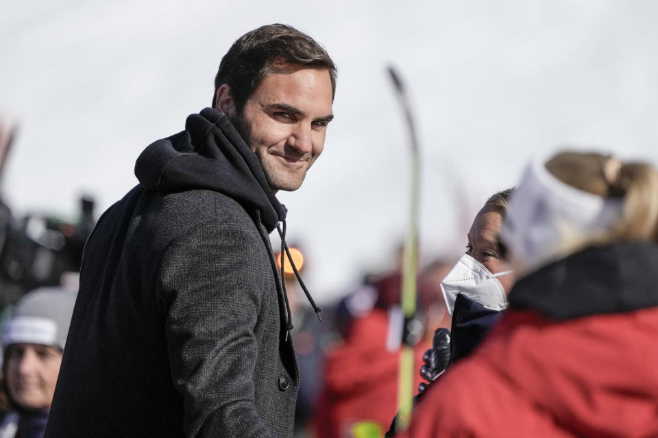 Switzerland's Roger Federer walks in the finish area of an alpine ski, women's World Cup super-G, in Lenzerheide, Switzerland, Saturday, March 5, 2022. (AP Photo/Giovanni Auletta)