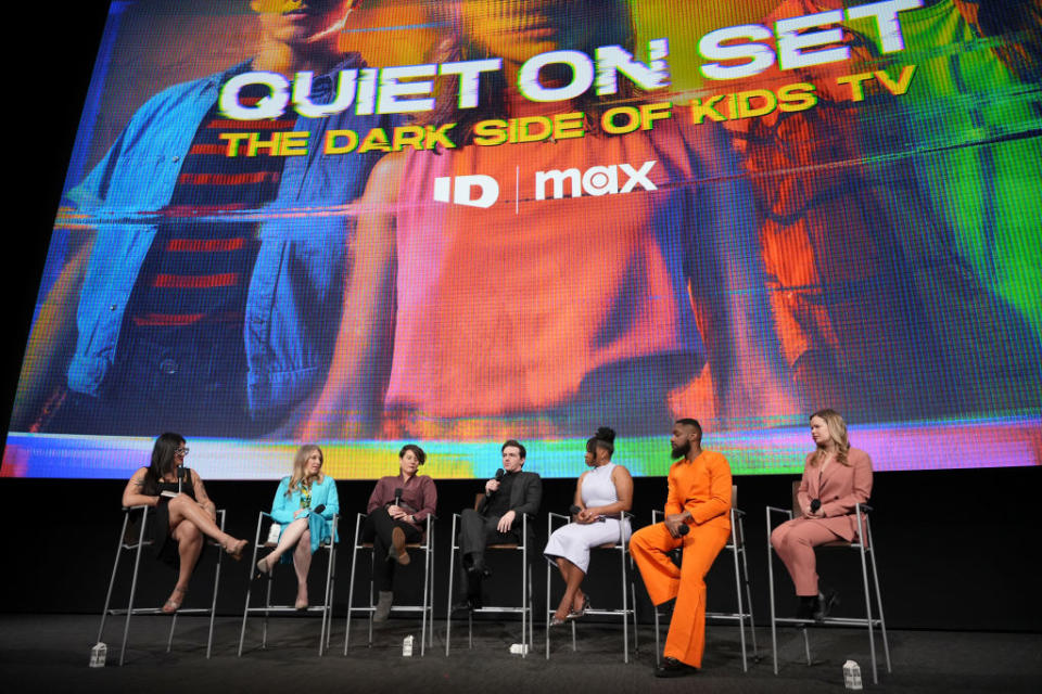 Panelists sit onstage for a discussion promoting "Quiet On Set," a documentary about children's television