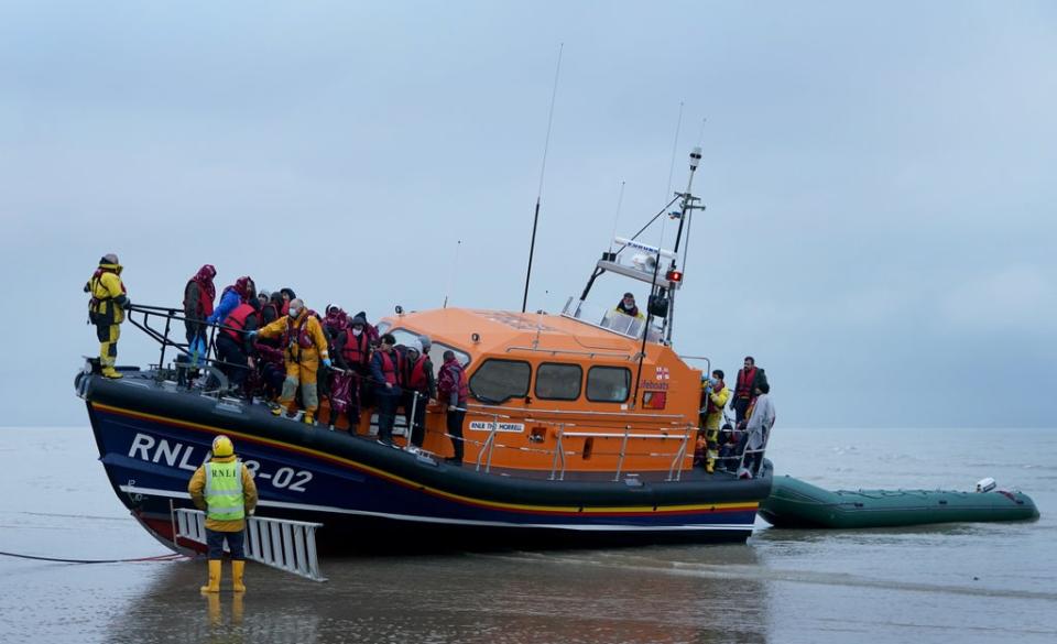 A group of people thought to be migrants are brought in to Dungeness, Kent, by the RNLI following a small boat incident in the Channel in November (Gareth Fuller/PA) (PA Wire)