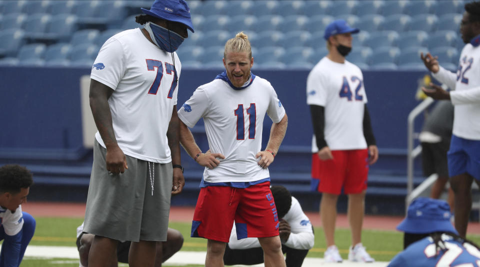 Buffalo Bills offensive tackle Ty Nsekhe (77) and Buffalo Bills wide receiver Cole Beasley (11) stretch in warm-ups at practice today at Bills Stadium in Orchard Park, N.Y. on Wednesday, Sept. 2, 2020. (James P. McCoy / Buffalo News, Pool)