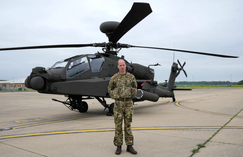 The future king in front of an Apache helicopter at the Army Aviation Centre in Middle Wallop, England, on Monday, May 13, 2024. POOL/AFP via Getty Images