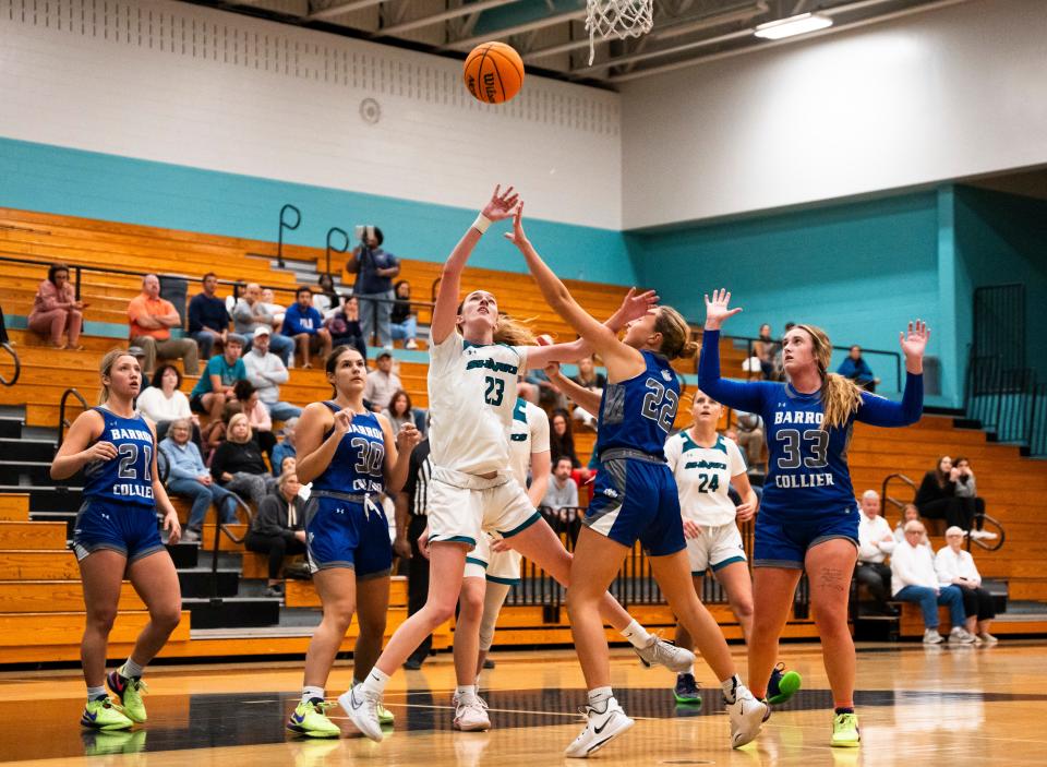 Gulf Coast Sharks forward Lilly Fultz (23) shoots a lay up during the first quarter of a game against the Barron Collier Cougars at Gulf Coast High School in Naples on Tuesday, Dec. 12, 2023.