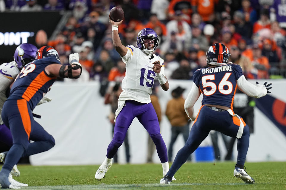 Minnesota Vikings quarterback Joshua Dobbs (15) throws as Denver Broncos linebacker Baron Browning (56) looks on during the second half on an NFL football game, Sunday, Nov. 19, 2023, in Denver. (AP Photo/Jack Dempsey)