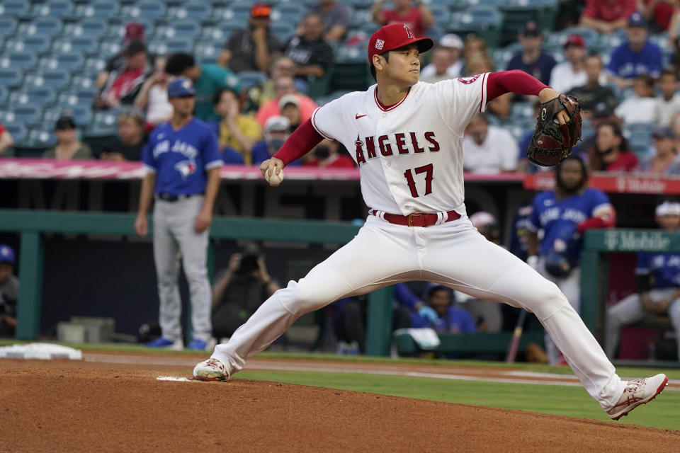 Los Angeles Angels starting pitcher Shohei Ohtani throws to a Toronto Blue Jays batter during the first inning of a baseball game Thursday, Aug. 12, 2021, in Anaheim, Calif. (AP Photo/Marcio Jose Sanchez)
