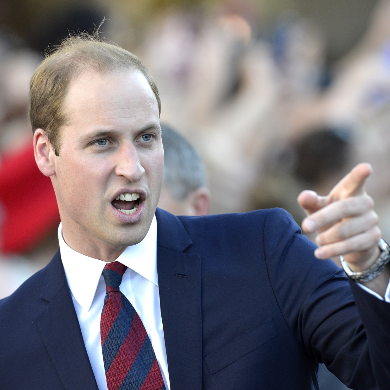  Prince William, Duke of Cambridge is seen pointing to something in the crowd on April 19, 2014 in Brisbane, Australia. 