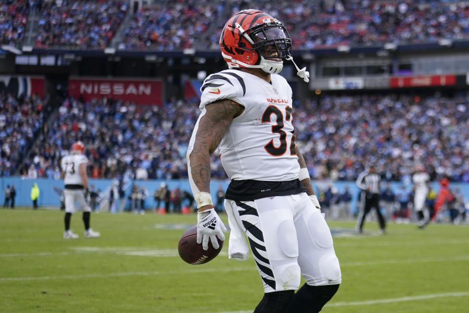 Cincinnati Bengals running back Trayveon Williams (32) celebrates his carry against the Tennessee Titans during the second half of an NFL football game, Sunday, Nov. 27, 2022, in Nashville, Tenn. The Cincinnati Bengals won 20-16. (AP Photo/Gerald Herbert)