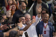 Brazil's former President Luiz Inacio Lula da Silva, who is running for reelection, takes a selfie with a supporter during a campaign rally outside the Volkswagen automakers plant in Sao Bernardo do Campo, greater Sao Paulo area, Brazil, Tuesday, Aug. 16, 2022. Brazil's general elections are scheduled for Oct. 2, 2022. (AP Photo/Andre Penner)